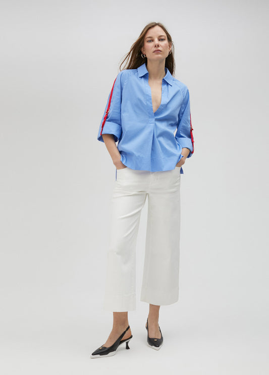 CAMISA COM RISCA LATERAL